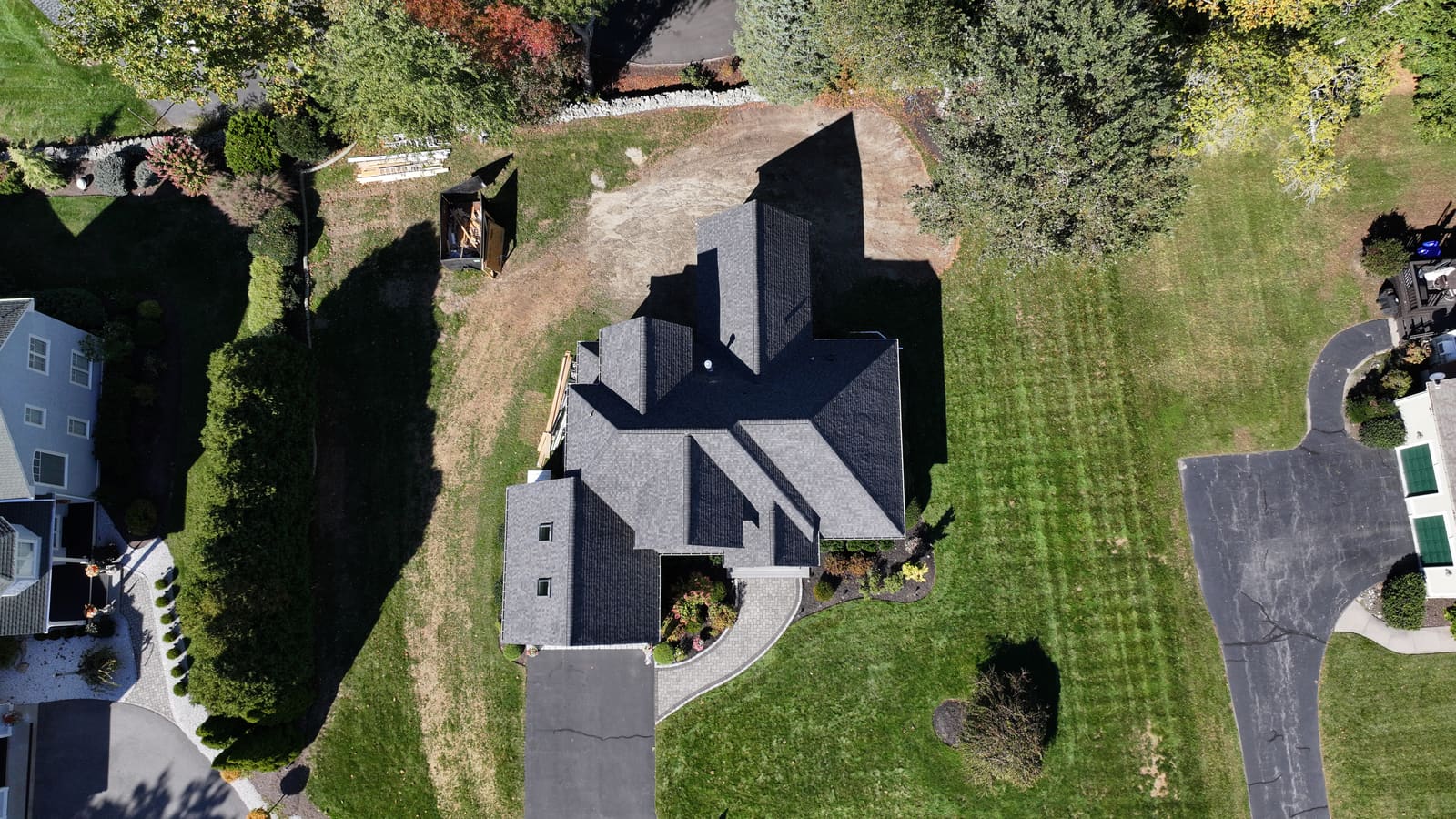 Dark asphalt shingle roof on a house seen from directly above