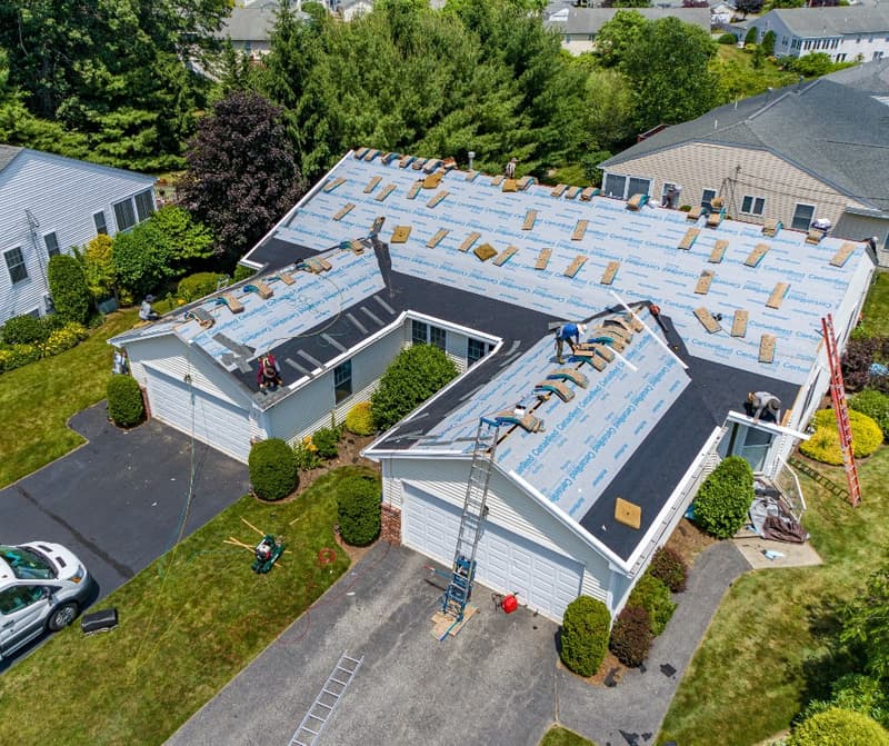 Crew on a roof with underlayment installed