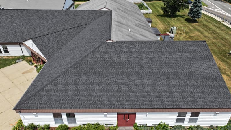 Close view of a large dark shingle roof